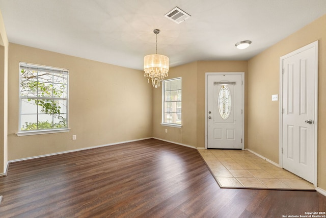 3628 Tilden, New Braunfels, TX 78132 - entrance foyer with a chandelier, wood finished floors, and baseboards