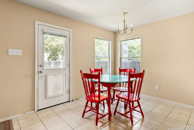 3628 Tilden, New Braunfels, TX 78132 - dining space featuring a chandelier, light tile patterned floors, and baseboards