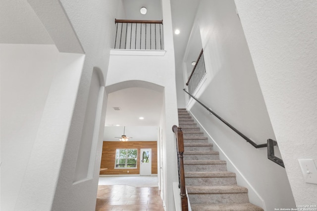 5801 Devonwood, Cibolo, TX 78108 - stairs with a towering ceiling, arched walkways, recessed lighting, and ceiling fan