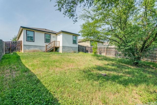 5518 Salado Fls, San Antonio, TX 78222 - rear view of house featuring a fenced backyard and entry steps