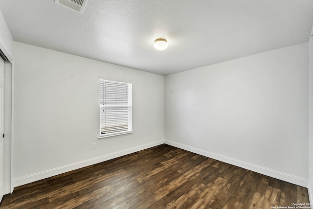 11219 Five Iron, San Antonio, TX 78221 - unfurnished room with dark wood finished floors and baseboards