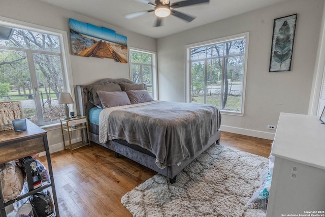 507 Twin Elm, Canyon Lake, TX 78133 - bedroom featuring wood finished floors, baseboards, and a ceiling fan