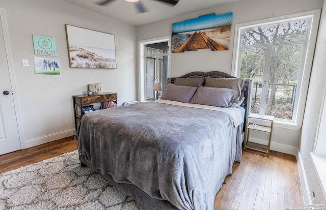 507 Twin Elm, Canyon Lake, TX 78133 - bedroom with baseboards, hardwood / wood-style floors, and ceiling fan