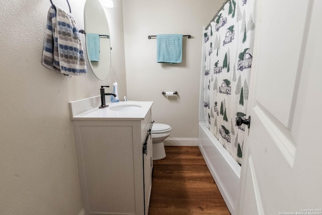 507 Twin Elm, Canyon Lake, TX 78133 - full bathroom featuring wood finished floors, baseboards, toilet, vanity, and shower / bath combo with shower curtain