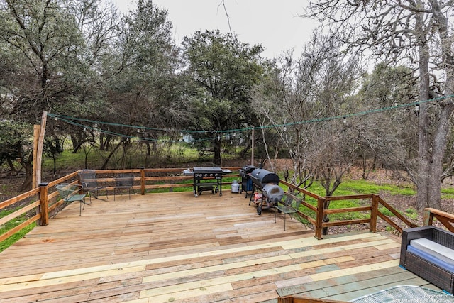 507 Twin Elm, Canyon Lake, TX 78133 - wooden deck featuring grilling area and view of wooded area