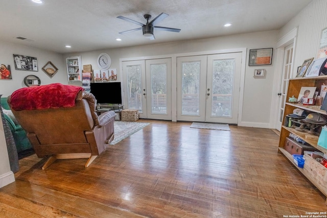 507 Twin Elm, Canyon Lake, TX 78133 - living area with healthy amount of natural light, wood finished floors, french doors, a ceiling fan, and recessed lighting