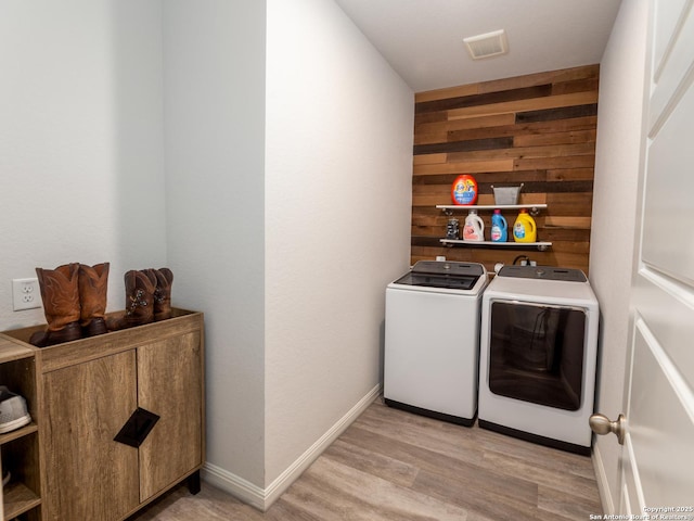 4926 Drifter Oaks, Saint Hedwig, TX 78152 - washroom with independent washer and dryer, light wood finished floors, wood walls, and baseboards
