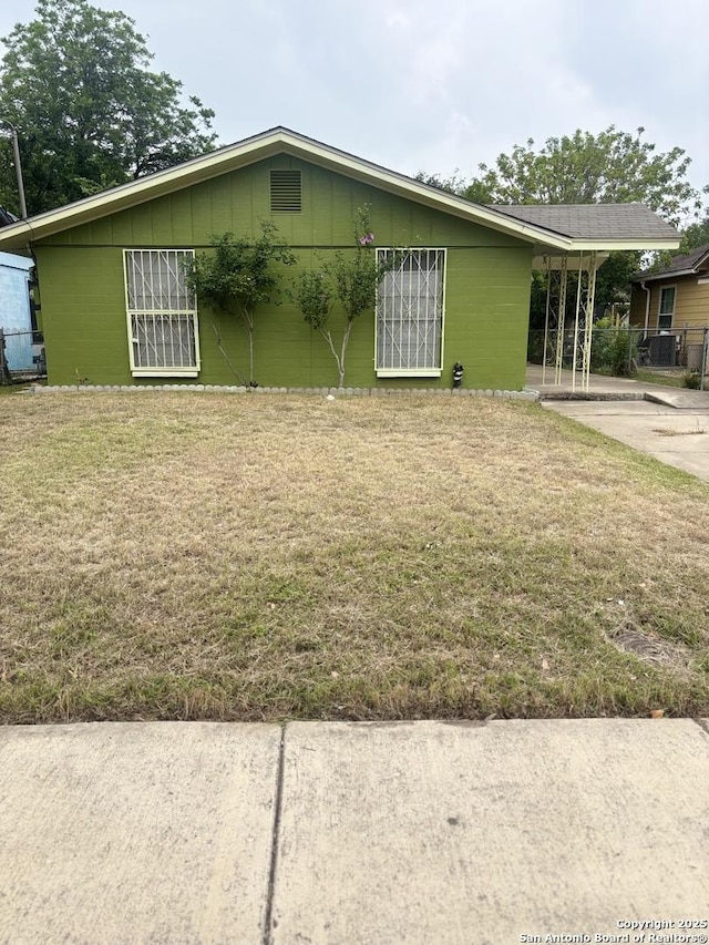 1238 Kendalia, San Antonio, TX 78224 - view of side of home featuring concrete block siding and a yard