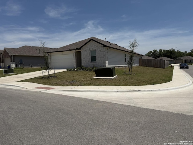 322 Addison, Lockhart, TX 78644 - view of front facade featuring concrete driveway, an attached garage, and brick siding