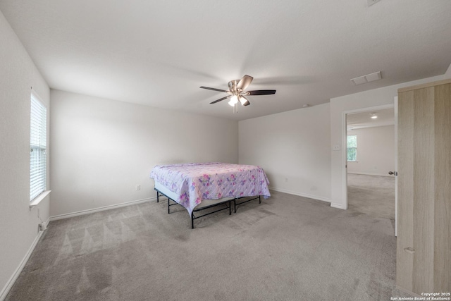 8022 Blackhawk Pass, San Antonio, TX 78253 - carpeted bedroom with baseboards and a ceiling fan
