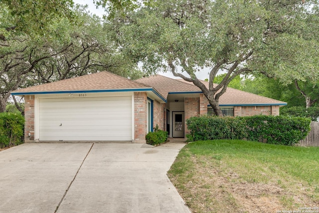 8763 Silent Oaks, San Antonio, TX 78250 - ranch-style home featuring driveway, an attached garage, a shingled roof, and brick siding