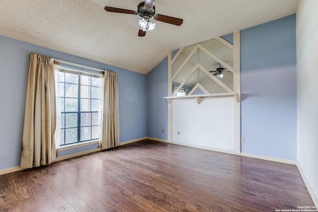 8763 Silent Oaks, San Antonio, TX 78250 - spare room with a ceiling fan, wood finished floors, healthy amount of natural light, a textured ceiling, and vaulted ceiling