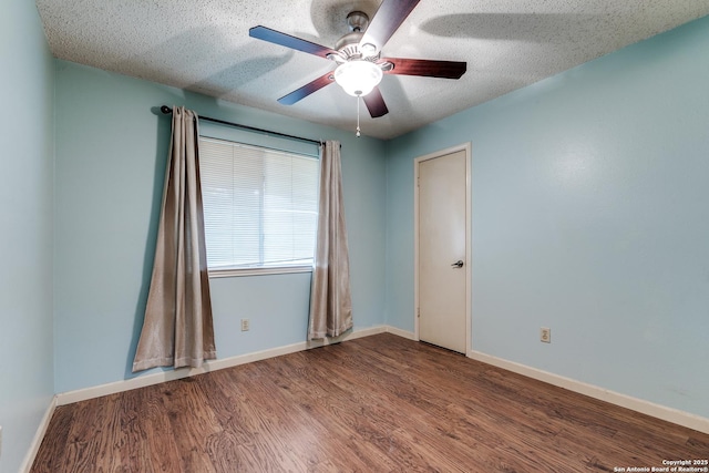 8763 Silent Oaks, San Antonio, TX 78250 - unfurnished room featuring wood finished floors, a ceiling fan, baseboards, and a textured ceiling