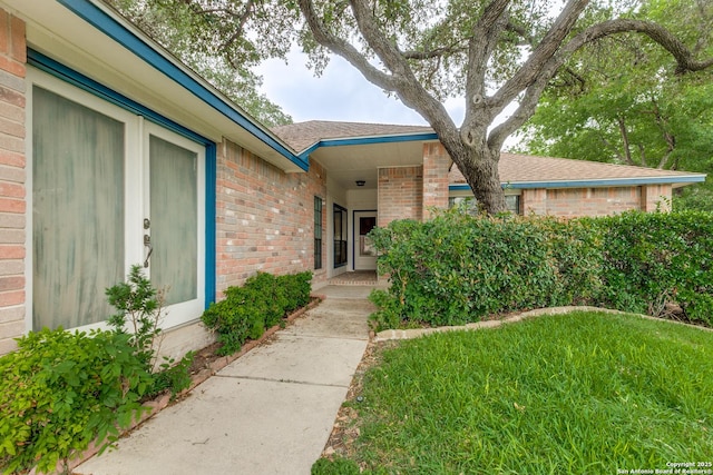 8763 Silent Oaks, San Antonio, TX 78250 - entrance to property with brick siding and roof with shingles