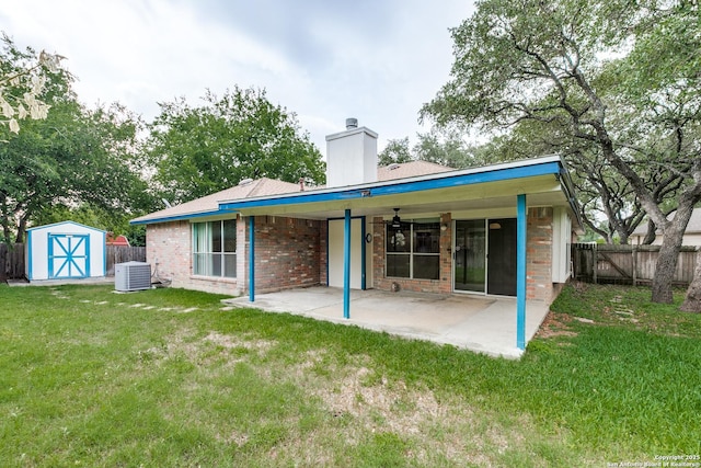 8763 Silent Oaks, San Antonio, TX 78250 - back of property with cooling unit, a patio area, brick siding, and a chimney
