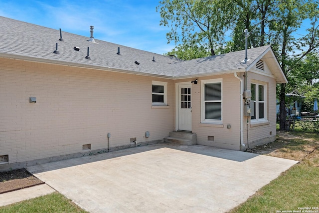 2523 W Kings Hwy, San Antonio, TX 78228 - rear view of house with crawl space, a patio area, entry steps, brick siding, and a shingled roof