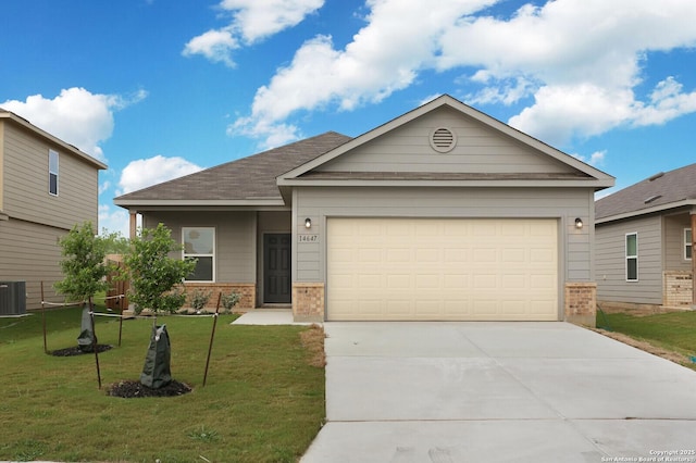 14647 Stirrup Trce, Elmendorf, TX 78112 - single story home featuring brick siding, driveway, a garage, and a front lawn