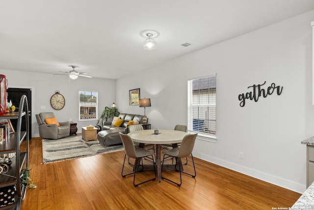 419 Channing Ave, San Antonio, TX 78210 - dining area with light wood finished floors, ceiling fan, and baseboards