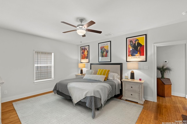 419 Channing Ave, San Antonio, TX 78210 - bedroom featuring light wood-type flooring, baseboards, and a ceiling fan