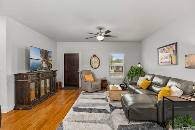 419 Channing Ave, San Antonio, TX 78210 - living area with light wood-type flooring, a ceiling fan, and baseboards