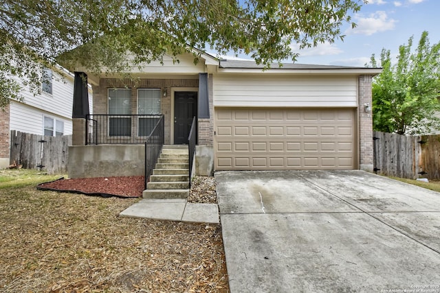10374 Oakwood Crst, San Antonio, TX 78245 - view of front of property featuring covered porch, brick siding, a garage, and concrete driveway