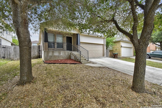 10374 Oakwood Crst, San Antonio, TX 78245 - view of front of property with an attached garage, driveway, and a porch