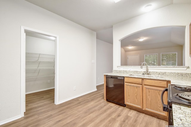 10374 Oakwood Crst, San Antonio, TX 78245 - kitchen featuring black appliances, a sink, light wood finished floors, arched walkways, and baseboards