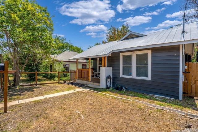 1726 Center, San Antonio, TX 78202 - view of front facade featuring covered porch and metal roof