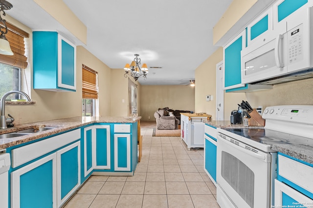 120 Westridge Dr, Springtown, TX 76082 - kitchen with white appliances, a sink, a chandelier, light tile patterned floors, and open floor plan