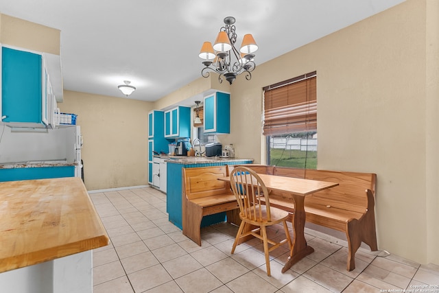 120 Westridge Dr, Springtown, TX 76082 - dining space with a chandelier and light tile patterned floors