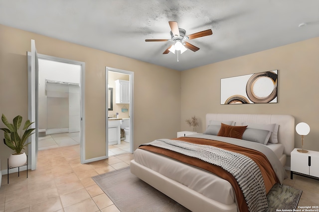 120 Westridge Dr, Springtown, TX 76082 - bedroom featuring light tile patterned flooring, a spacious closet, ensuite bathroom, and ceiling fan