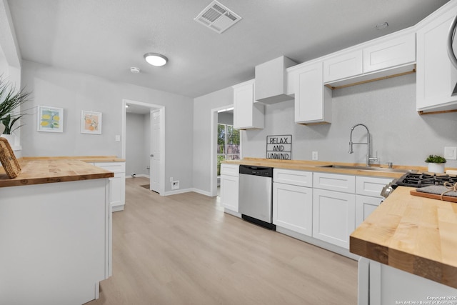 97 Denton, San Antonio, TX 78213 - kitchen featuring wooden counters, stainless steel dishwasher, a sink, light wood-type flooring, and white cabinets