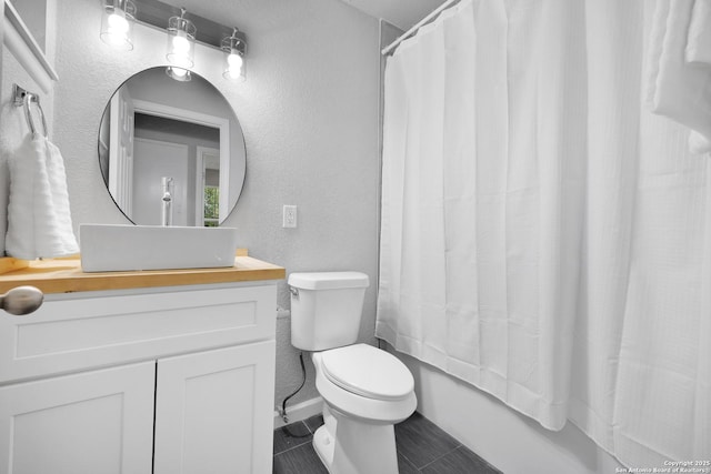 97 Denton, San Antonio, TX 78213 - full bathroom featuring a textured wall, toilet, vanity, and tile patterned floors