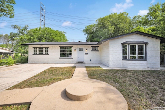 97 Denton, San Antonio, TX 78213 - view of front of property featuring concrete block siding and a front yard