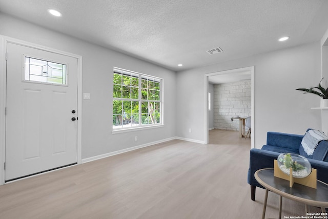 97 Denton, San Antonio, TX 78213 - foyer entrance featuring light wood-style flooring, a textured ceiling, recessed lighting, and baseboards