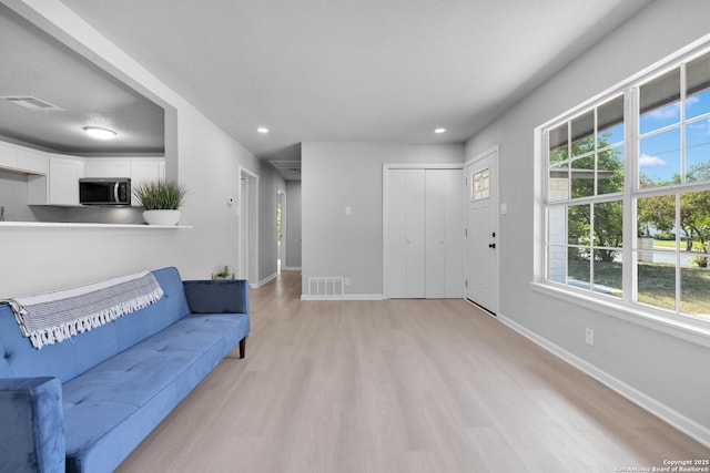 97 Denton, San Antonio, TX 78213 - living room with light wood-style floors, baseboards, plenty of natural light, and recessed lighting