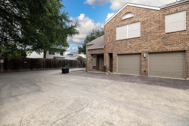8103 N New Braunfels Unit 19, San Antonio, TX 78209 - view of property exterior with brick siding and an attached garage