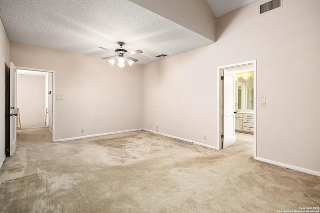 8103 N New Braunfels Unit 19, San Antonio, TX 78209 - spare room featuring ceiling fan, light colored carpet, a textured ceiling, and baseboards