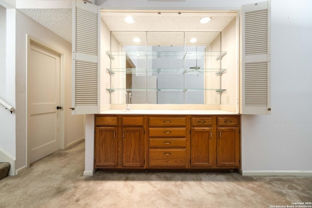8103 N New Braunfels Unit 19, San Antonio, TX 78209 - bathroom with baseboards, carpet floors, vanity, recessed lighting, and radiator heating unit