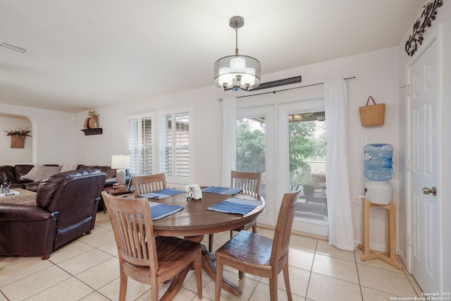 8022 Maddie Ln, San Antonio, TX 78255 - dining area with light tile patterned floors and a chandelier