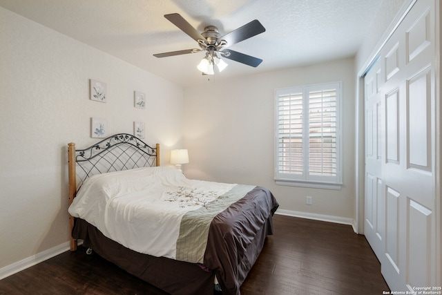 8022 Maddie Ln, San Antonio, TX 78255 - bedroom featuring baseboards, wood finished floors, a closet, and ceiling fan