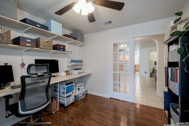 8022 Maddie Ln, San Antonio, TX 78255 - office space featuring ceiling fan, arched walkways, wood finished floors, and baseboards
