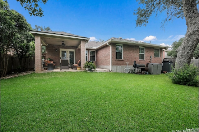 8022 Maddie Ln, San Antonio, TX 78255 - rear view of house with brick siding, ceiling fan, and a patio