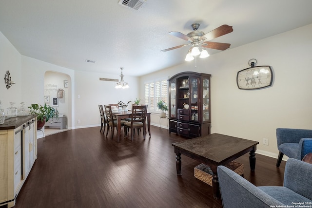 8022 Maddie Ln, San Antonio, TX 78255 - living area with arched walkways, ceiling fan, dark wood-style flooring, and baseboards