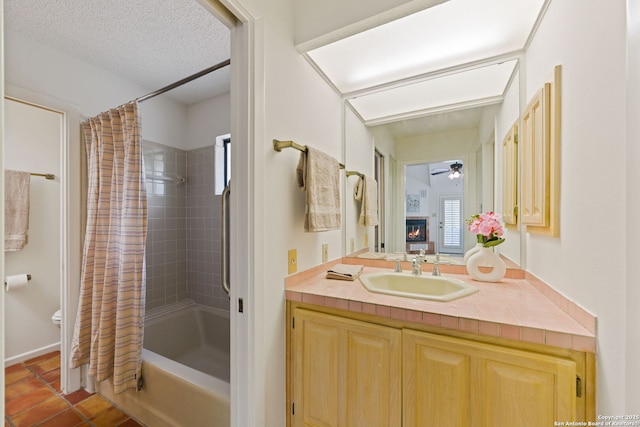 7519 Dijon Ct, San Antonio, TX 78209 - bathroom featuring ceiling fan, shower / bath combo with shower curtain, vanity, toilet, and tile patterned floors