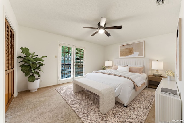 7519 Dijon Ct, San Antonio, TX 78209 - bedroom with access to exterior, light carpet, ceiling fan, baseboards, and a closet