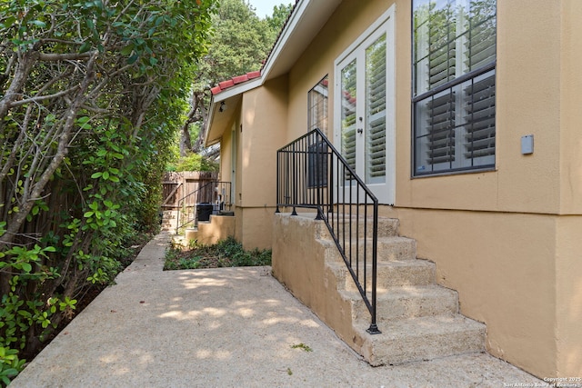 7519 Dijon Ct, San Antonio, TX 78209 - view of exterior entry featuring stucco siding and a patio area