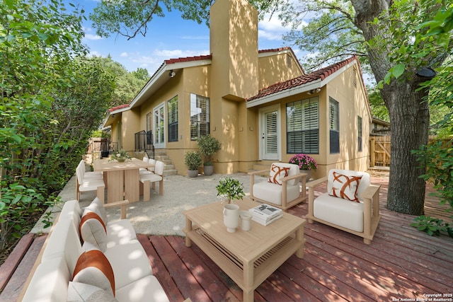 7519 Dijon Ct, San Antonio, TX 78209 - back of house featuring a tiled roof, stucco siding, a wooden deck, and a chimney