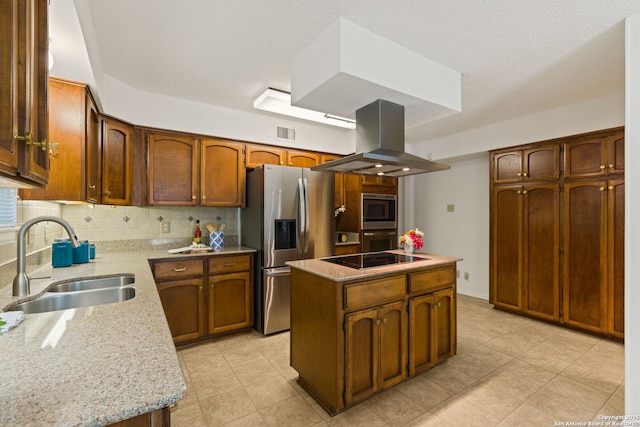 7519 Dijon Ct, San Antonio, TX 78209 - kitchen featuring island exhaust hood, a sink, appliances with stainless steel finishes, a kitchen island, and tasteful backsplash
