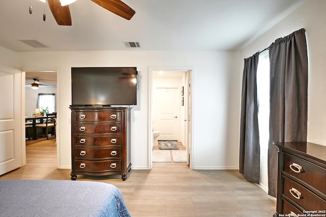 923 Cook Bnd, San Antonio, TX 78221 - bedroom with light wood finished floors, baseboards, connected bathroom, and ceiling fan